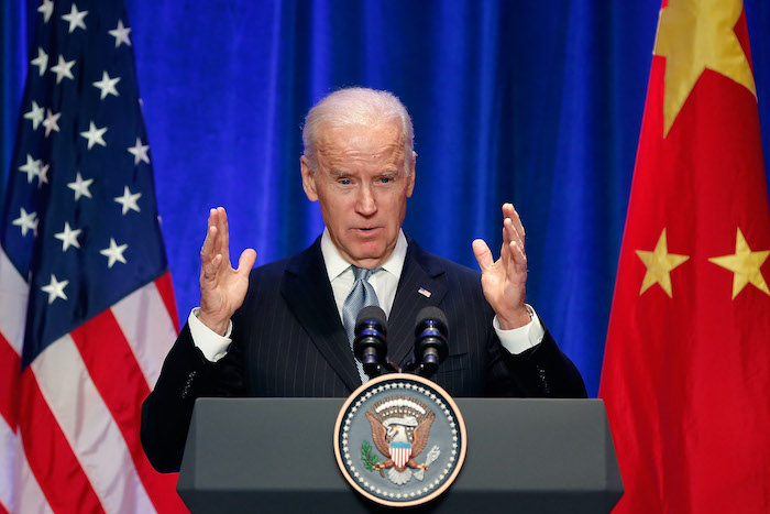 Joe Biden speaking at a podium