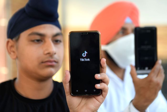 An India man uses the TikTok app