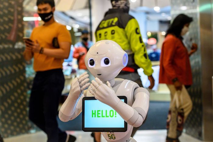 A robot in Bangkok warns shoppers about COVID-19
