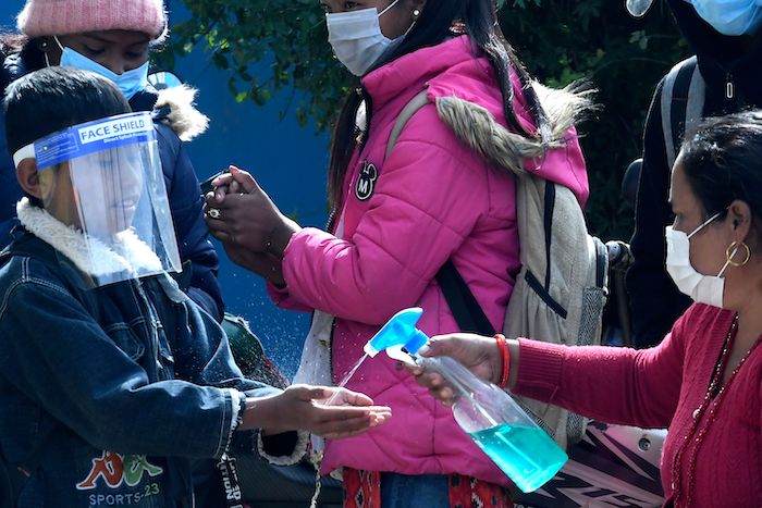 Children in Nepal get sanitizer for COVID-19