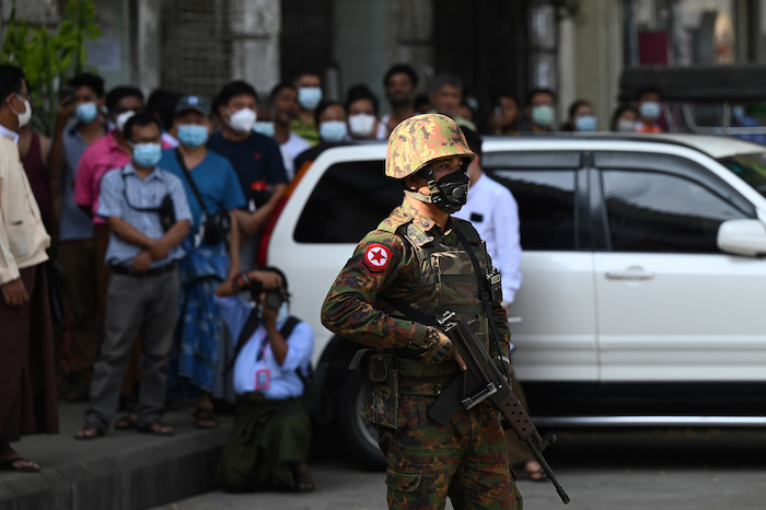 A soldier guards a mosque during coup in Myanmar