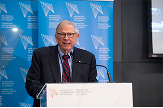 John H. McArthur speaking at podium