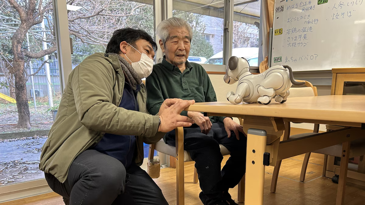 Elders in Japan with dog robot