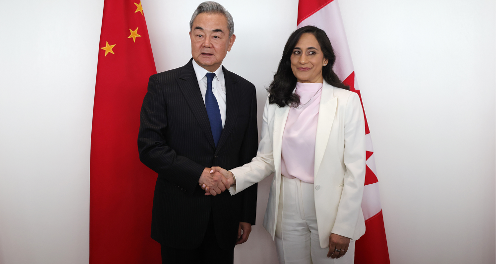 Wang Yi, China's foreign minister, left, and Anita Anand, Canada's foreign affairs minister
