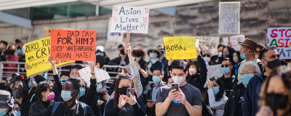 Youth hold rally with signs against anti-Asian racism