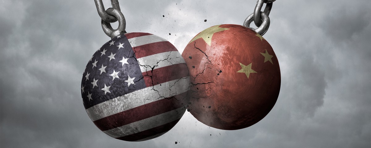 US and China flags on colliding wrecking balls 