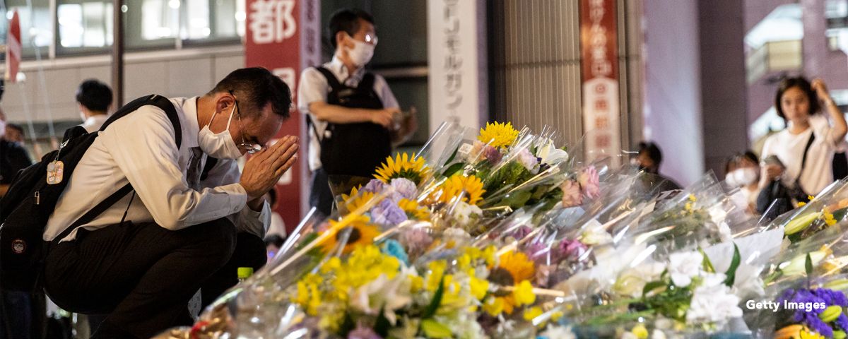 A man prays at a site outside of Yamato-Saidaiji Station where Japan’s former prime minister Shinzo Abe was shot during an election campaign on July 08, 2022 in Nara, Japan Getty Images