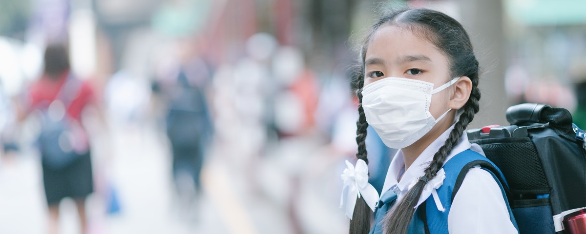 School girl in mask in Asia