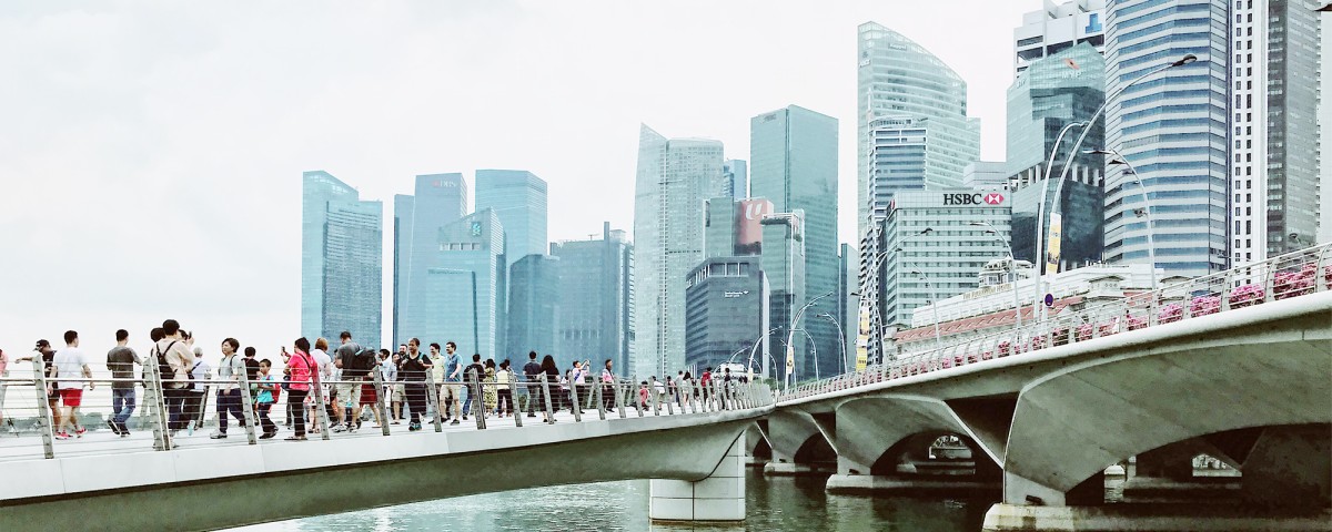 Singapore city scene of people on bridge