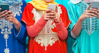 Indonesian women on mobile phones