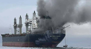 smoke rising from the Thai bulk carrier 'Mayuree Naree' near the Strait of Hormuz after an attack