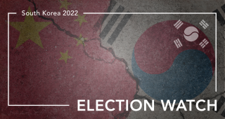 China and South Korea flags on cracked concrete with banner for Election Watch