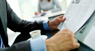 man reading newspaper