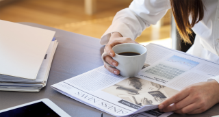 woman reading newspaper