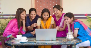 Indian women around a laptop