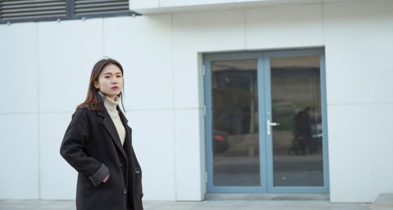 Young woman outside a building in China