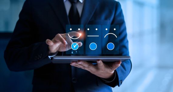 Business man completing a survey on an iPad