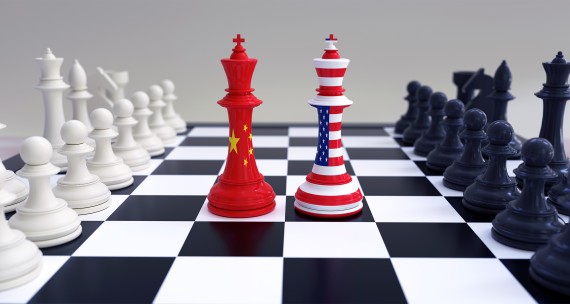 Chinese and American Flags on chess pieces on chessboard 