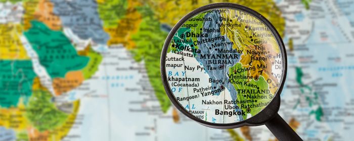 Close-up of Myanmar map under a magnifying glass