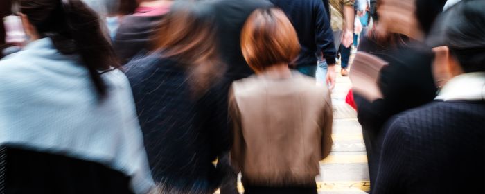 Woman in crowd on street in China 