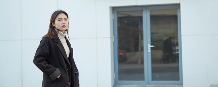 Young woman on a bleak street in China 