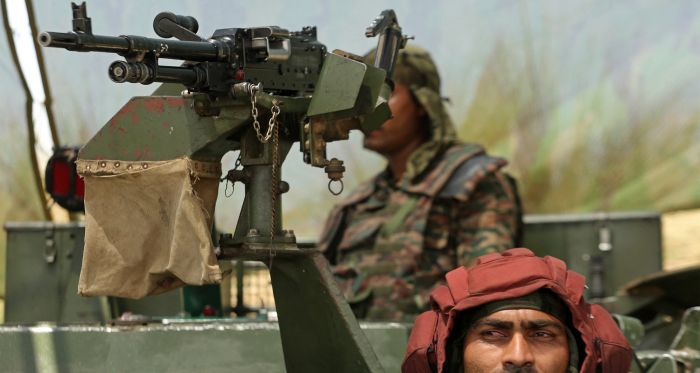 Indian army soldiers in an armoured vehicle at Akhnoor sector near the Line of Control (LoC) between India and Pakistan, in Jammu region on May 19, 2025. | Photo: Mukesh Gupta/AFP via Getty Images