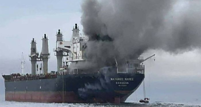 smoke rising from the Thai bulk carrier 'Mayuree Naree' near the Strait of Hormuz after an attack