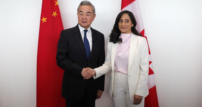Wang Yi, China's foreign minister, left, and Anita Anand, Canada's foreign affairs minister