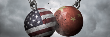 American and Chinese flags on colliding wrecking balls 